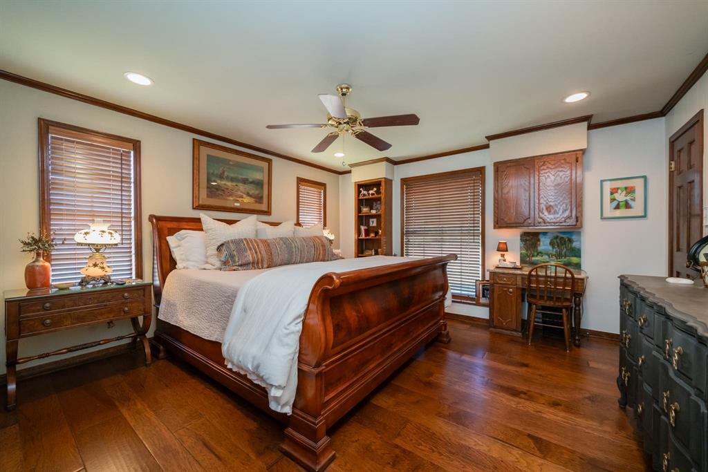 3843 Farm To Market 2199 Marshall, TX 75672 - Photo 20 of 40 a bedroom with a bed and wooden floor