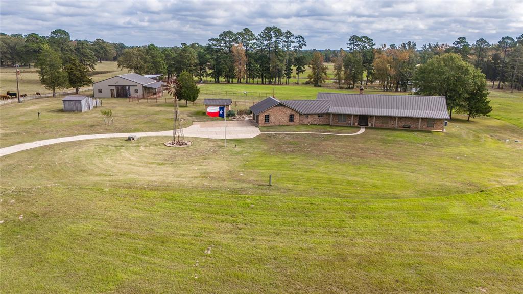 3843 Farm To Market 2199 Marshall, TX 75672 - Photo 2 of 40 an aerial view of a house with a swimming pool