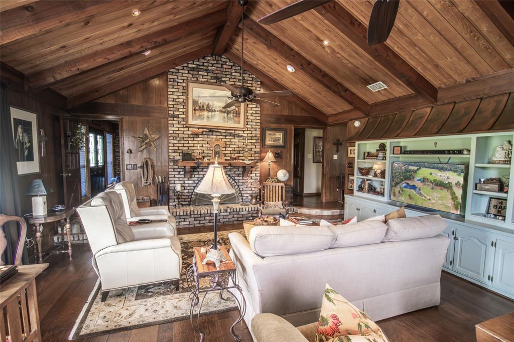 3843 Farm To Market 2199 Marshall, TX 75672 - Photo 6 of 40 a living room with furniture and a chandelier