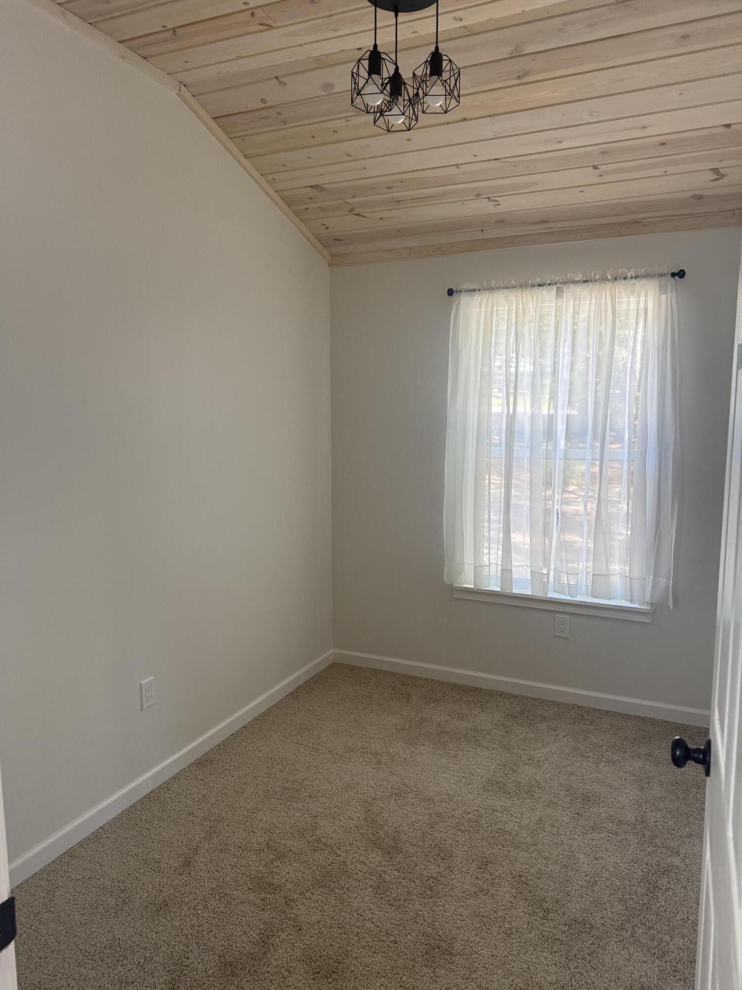 749 Brookside Drive DeFuniak Springs, FL 32433 - Photo 13 of 18 an empty room with a empty space and windows