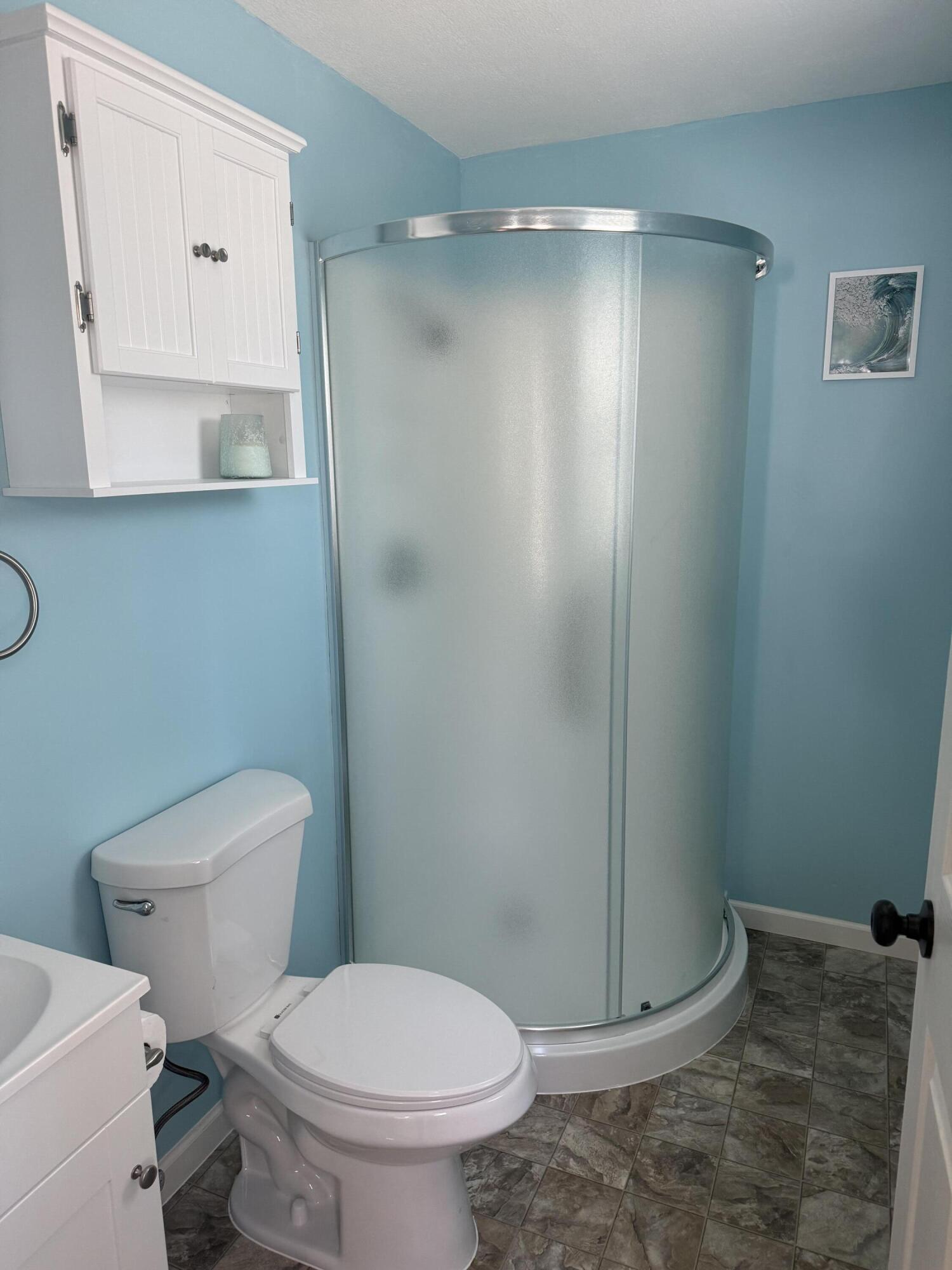 749 Brookside Drive DeFuniak Springs, FL 32433 - Photo 15 of 18 a white toilet sitting next to a bathroom sink
