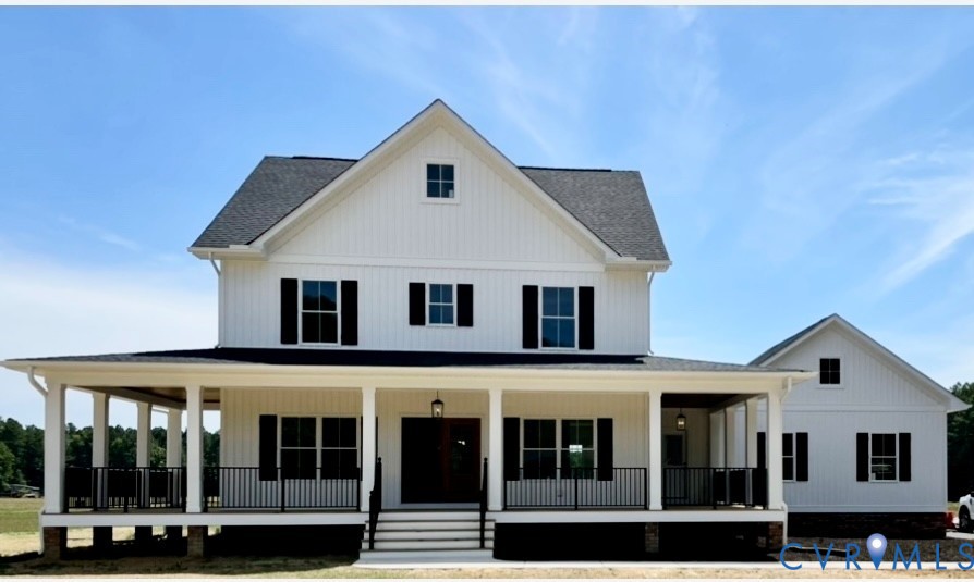11537 Mt Hope Church Road Doswell, VA 23047 - Photo 1 of 10 a view of a white house with large windows and a small yard