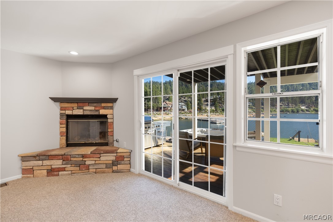 735 Tayles Point Road Big Bear Lake, CA 92315 - Photo 23 of 47 Cozy seating area next to kitchen, own fireplace and lakeside access