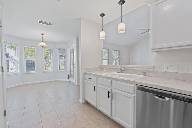 a bathroom with a sink vanity and a mirror