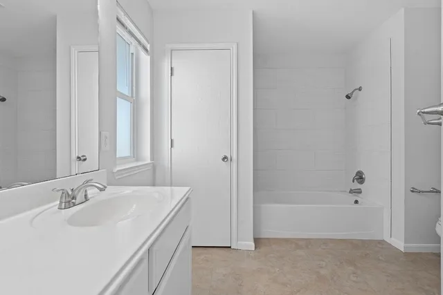 a bathroom with a sink and a bathtub
