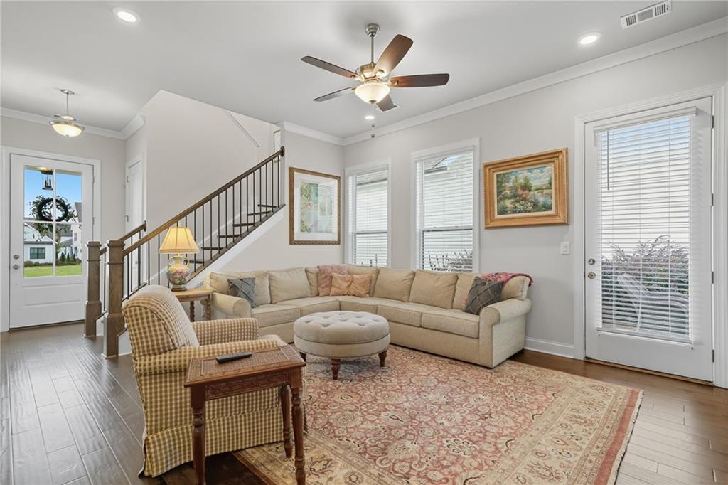514 Homestead Park Place Canton, GA 30115 - Photo 11 of 38 a living room with furniture and a large window with wooden floor