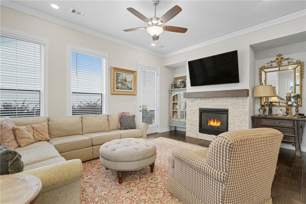 514 Homestead Park Place Canton, GA 30115 - Photo 12 of 38 a living room with furniture fireplace and a flat screen tv