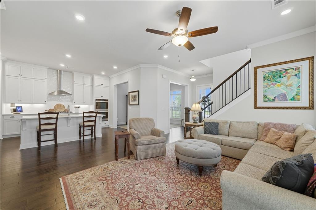 514 Homestead Park Place Canton, GA 30115 - Photo 14 of 38 a living room with furniture kitchen view and a dining table