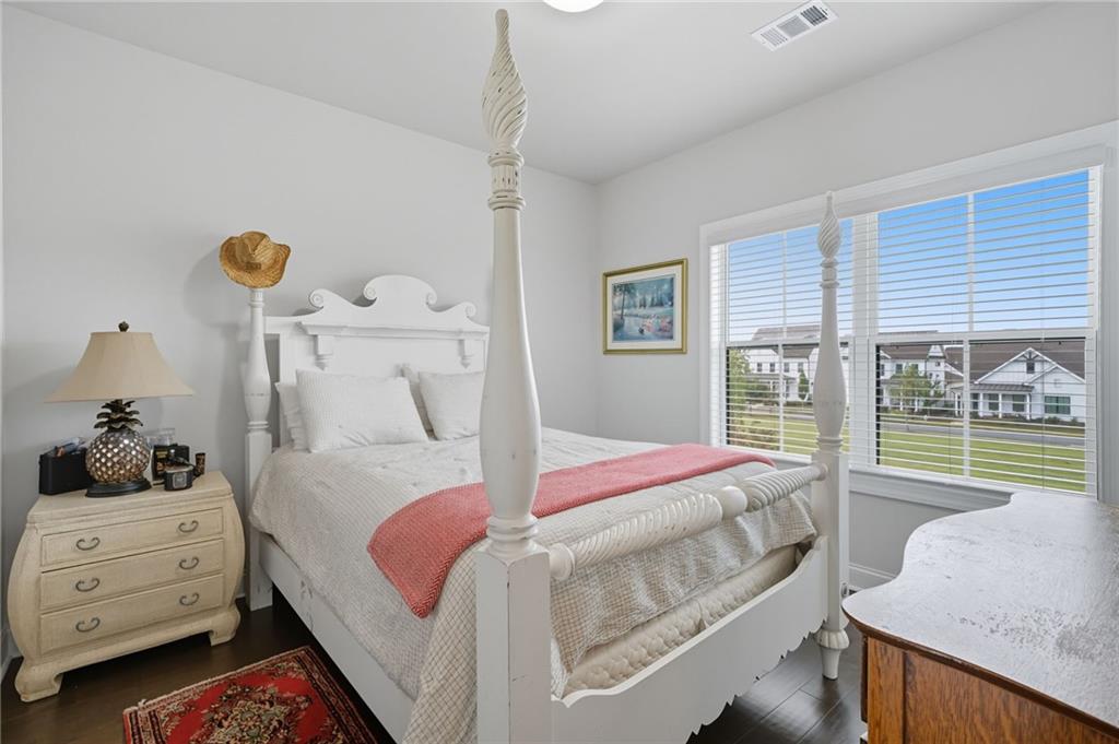 514 Homestead Park Place Canton, GA 30115 - Photo 24 of 38 a bedroom with a bed and large window