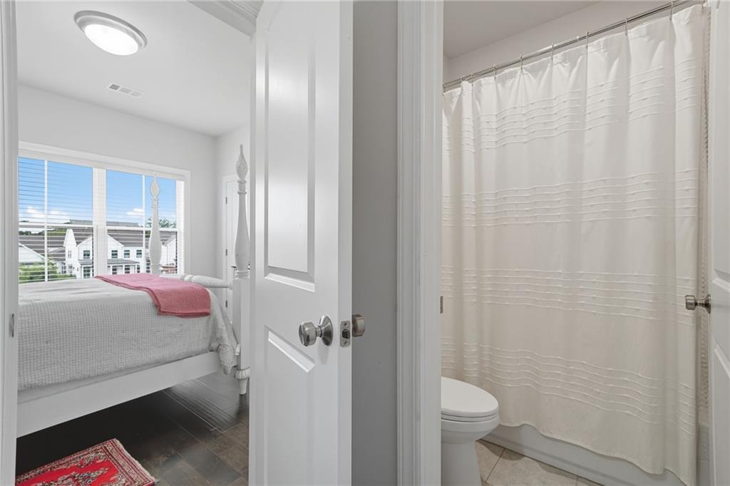 514 Homestead Park Place Canton, GA 30115 - Photo 28 of 38 a bathroom with a sink toilet and shower