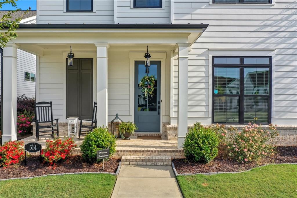 514 Homestead Park Place Canton, GA 30115 - Photo 4 of 38 a front view of a house with plants