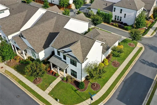 an aerial view of a house with a garden and plants