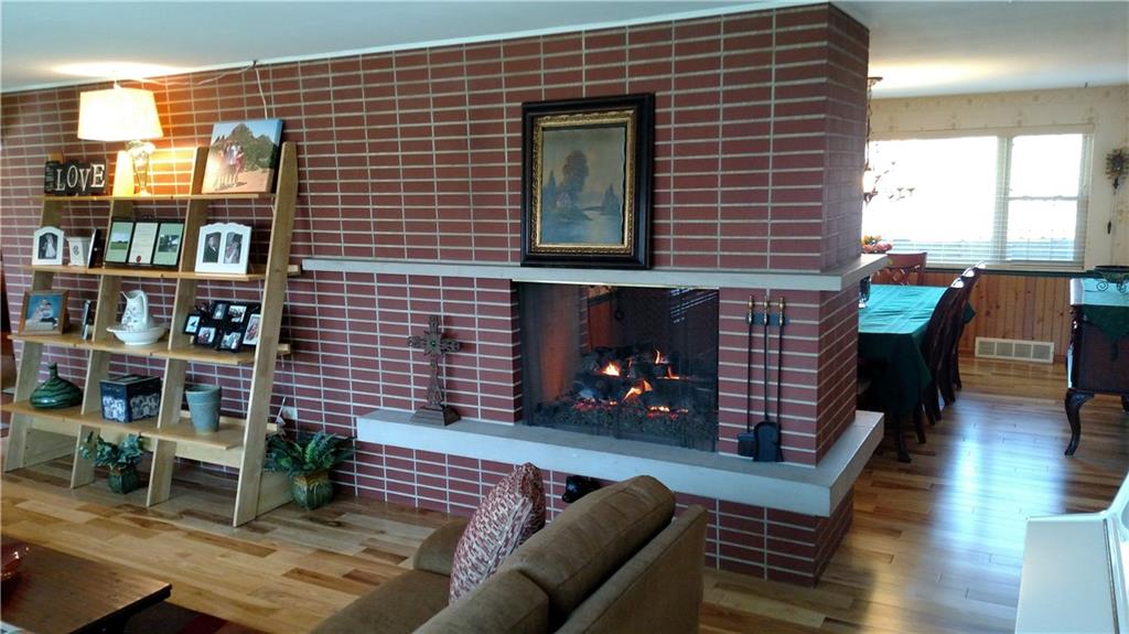 125 Dalecrest Road Penn Hills, PA 15147 - Photo 23 of 24 Enjoy the Double Sided Gas Log burning fireplace and the beautiful hardwood floors in the living room and dining room.