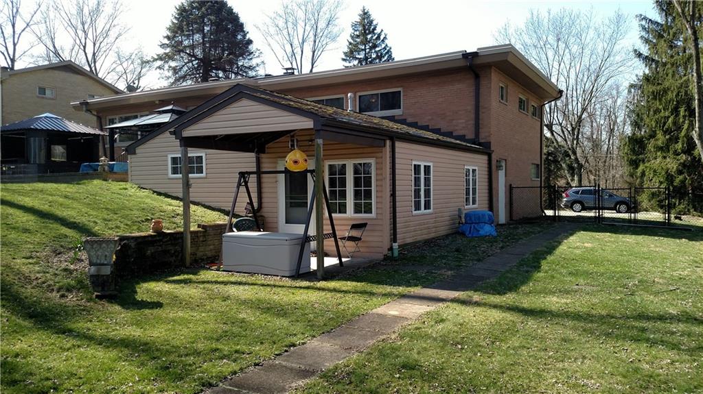 125 Dalecrest Road Penn Hills, PA 15147 - Photo 24 of 24 Rear view of the attached apartment with own entry or can be accessed from the main home. Great for inlaws, out of town guests, features Equipped Kitchen, LR, 1 Bedroom, Laundry hookups, walk in shower.