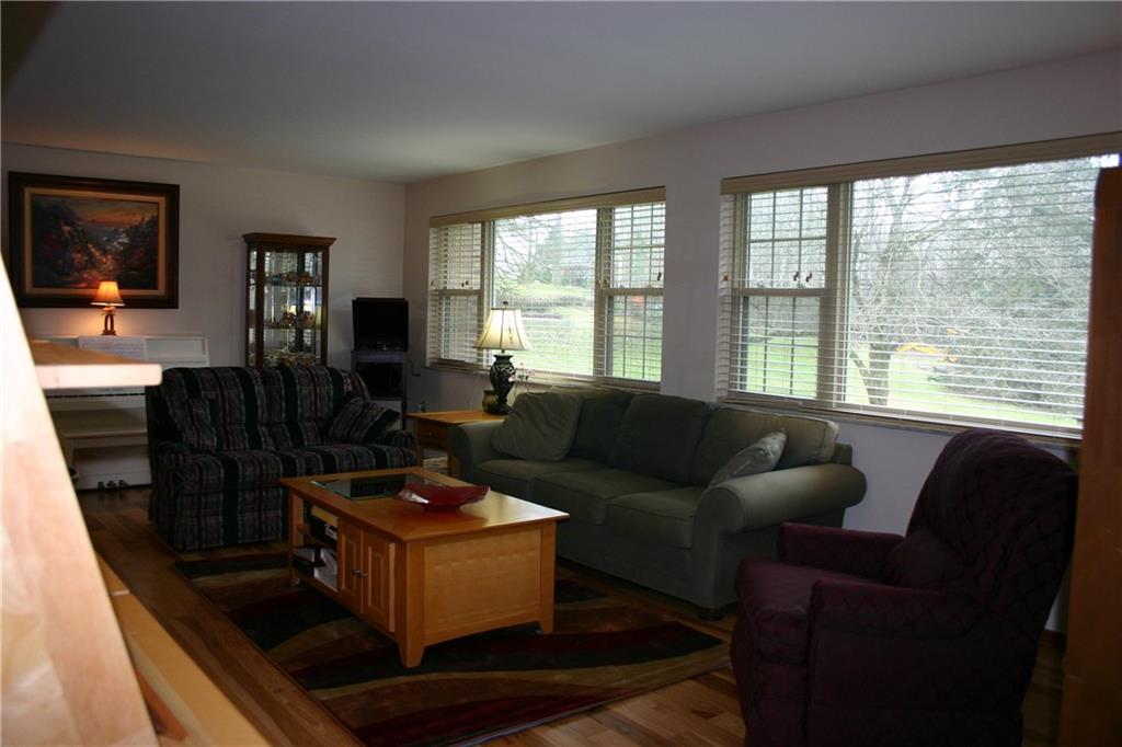 125 Dalecrest Road Penn Hills, PA 15147 - Photo 6 of 24 Large Living room with New Hardwood Floors, Windows and Treatments