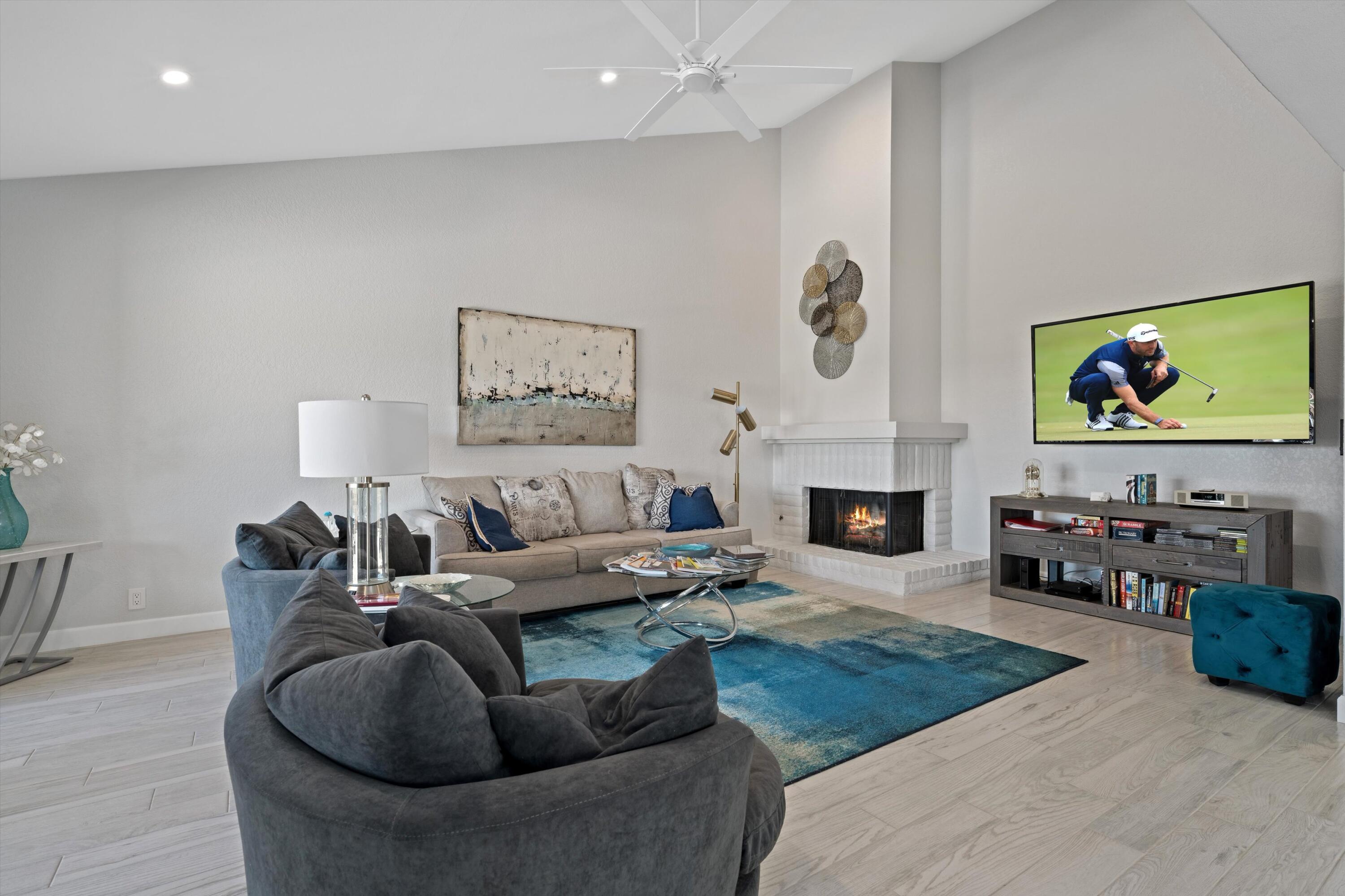 34 Maximo Way Palm Desert, CA 92260 - Photo 15 of 31 a living room with furniture a fireplace and window