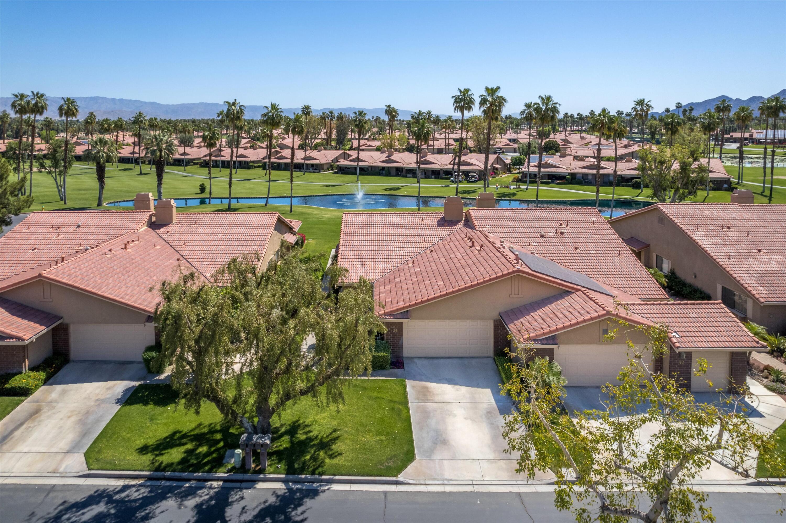 34 Maximo Way Palm Desert, CA 92260 - Photo 3 of 31 an aerial view of a house with a lake view