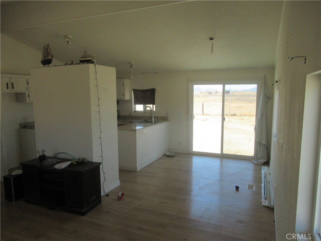 14555 Artesia Trail Santa Margarita, CA 93453 - Photo 12 of 21 a view of a refrigerator in kitchen and a window