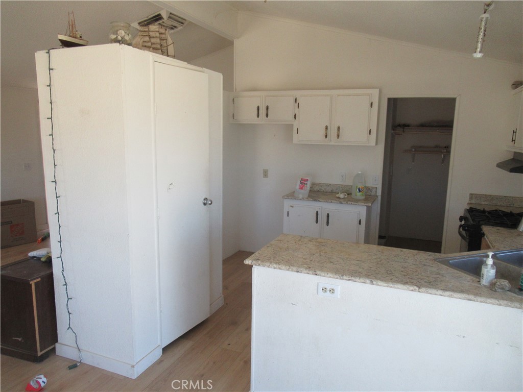14555 Artesia Trail Santa Margarita, CA 93453 - Photo 15 of 21 a room with a sink and a refrigerator