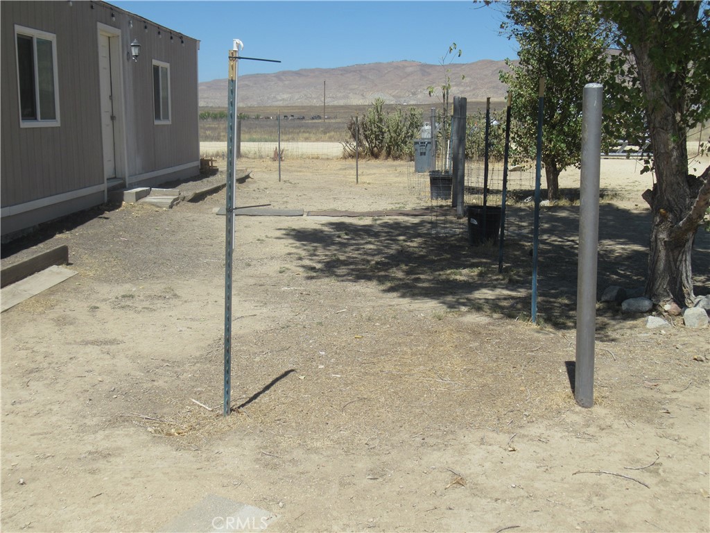 14555 Artesia Trail Santa Margarita, CA 93453 - Photo 20 of 21 a view of a backyard of a house