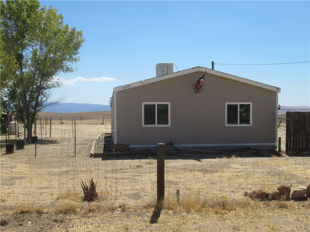 14555 Artesia Trail Santa Margarita, CA 93453 - Photo 2 of 21 a front view of a house with a yard