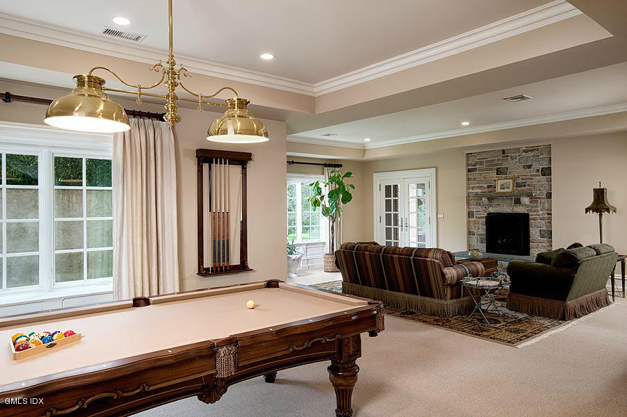 3 Jada Lane Greenwich, CT 06830 - Photo 15 of 26 a living room with furniture a fireplace and a window