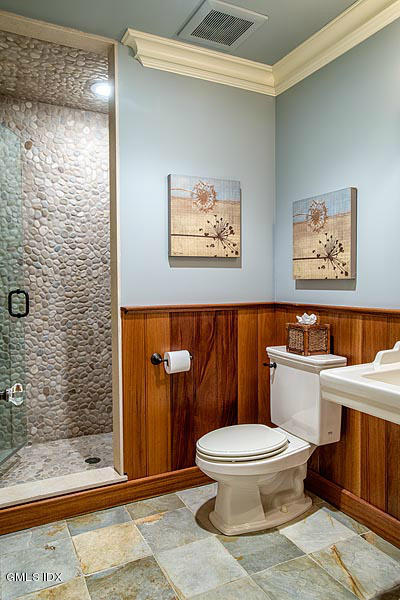 3 Jada Lane Greenwich, CT 06830 - Photo 17 of 26 a white toilet sitting next to a bathroom sink
