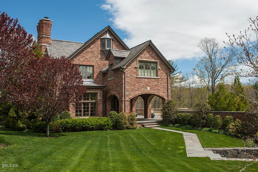 3 Jada Lane Greenwich, CT 06830 - Photo 23 of 26 a front view of a house with a yard