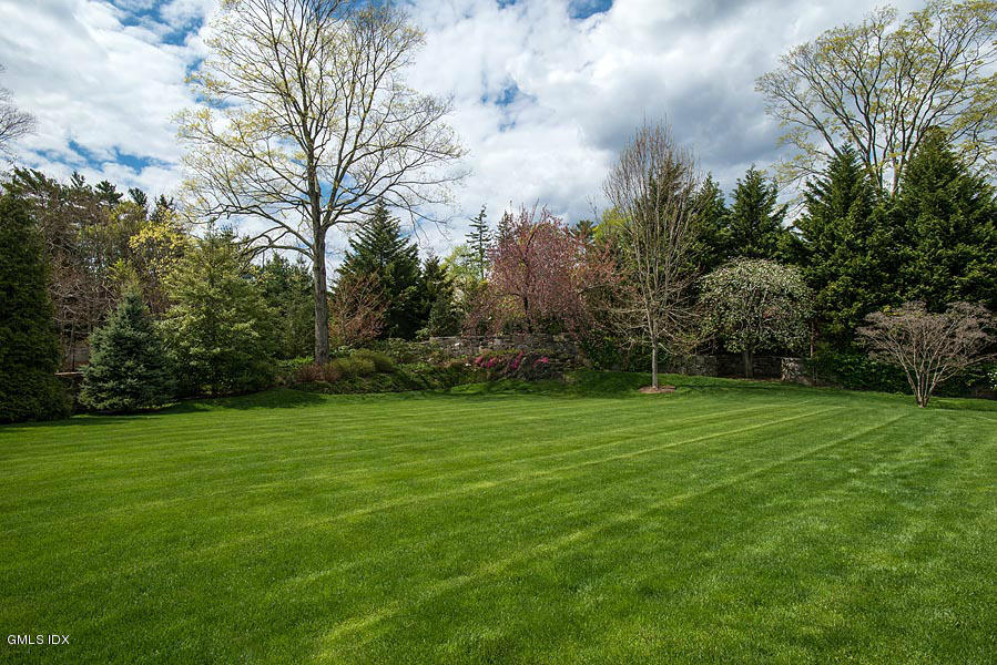 3 Jada Lane Greenwich, CT 06830 - Photo 24 of 26 a view of a grassy field with trees