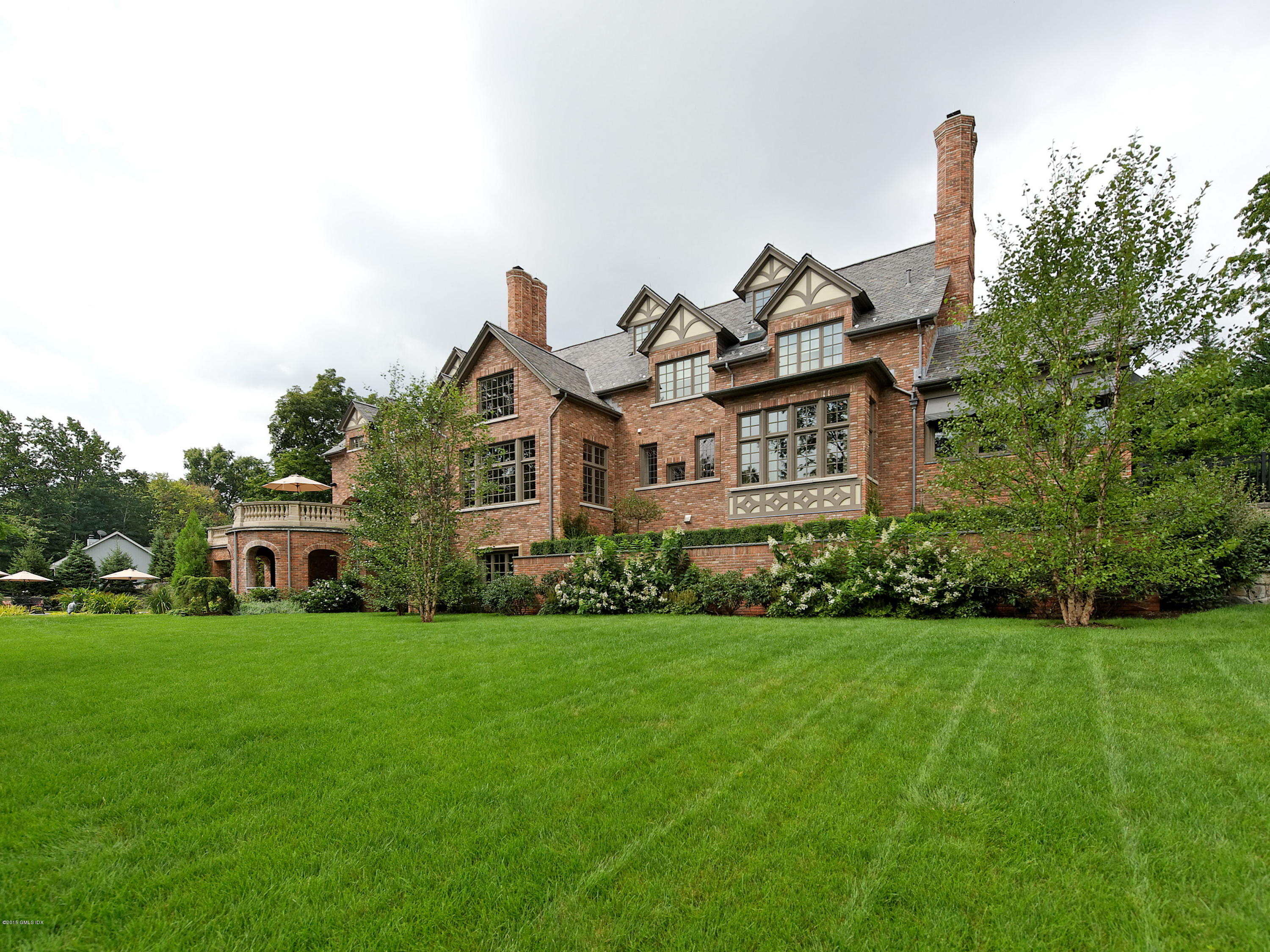 3 Jada Lane Greenwich, CT 06830 - Photo 26 of 26 a front view of a house with a garden
