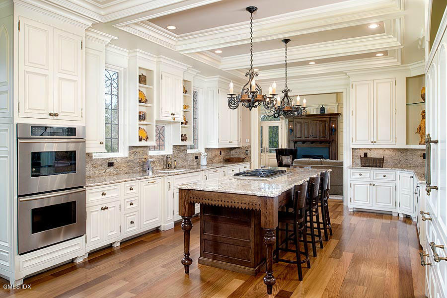 3 Jada Lane Greenwich, CT 06830 - Photo 4 of 26 a kitchen that has a lot of cabinets in it and wooden floor