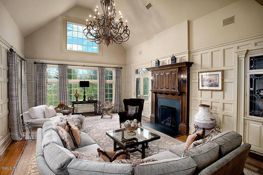 3 Jada Lane Greenwich, CT 06830 - Photo 6 of 26 a living room with furniture a fireplace and a chandelier
