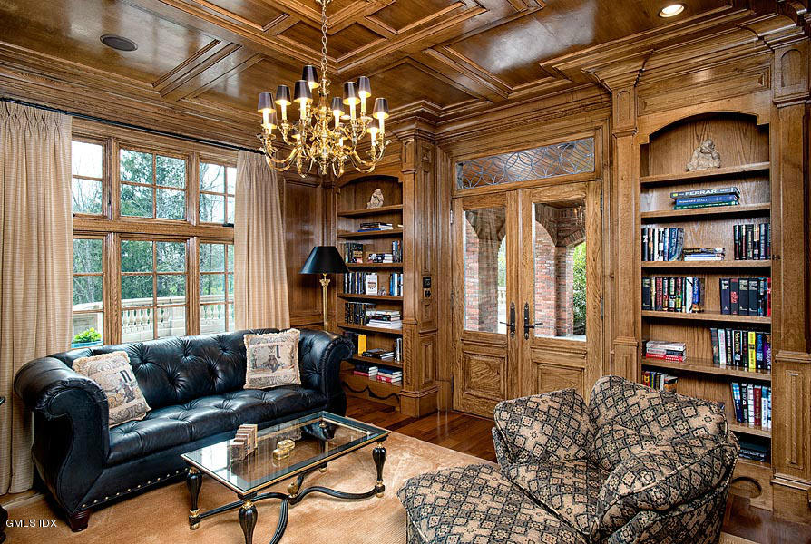 3 Jada Lane Greenwich, CT 06830 - Photo 8 of 26 a living room with furniture a bookshelf and a chandelier