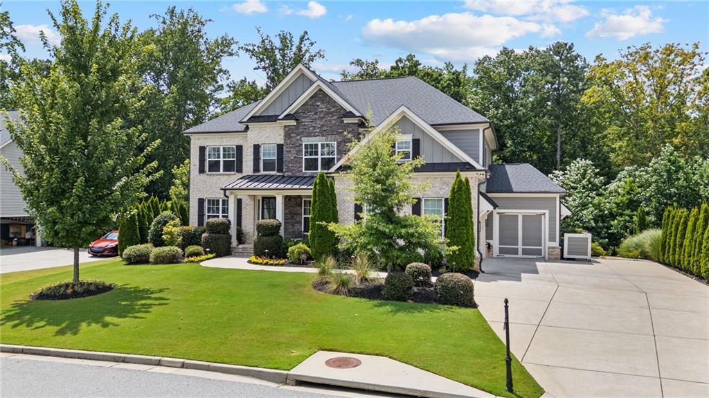 a front view of a house with a yard