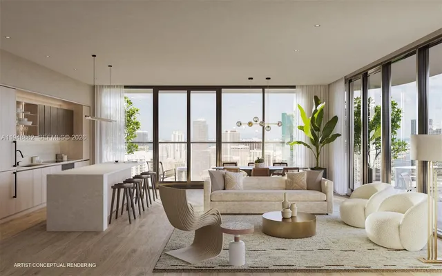 a living room with fireplace furniture and a large window