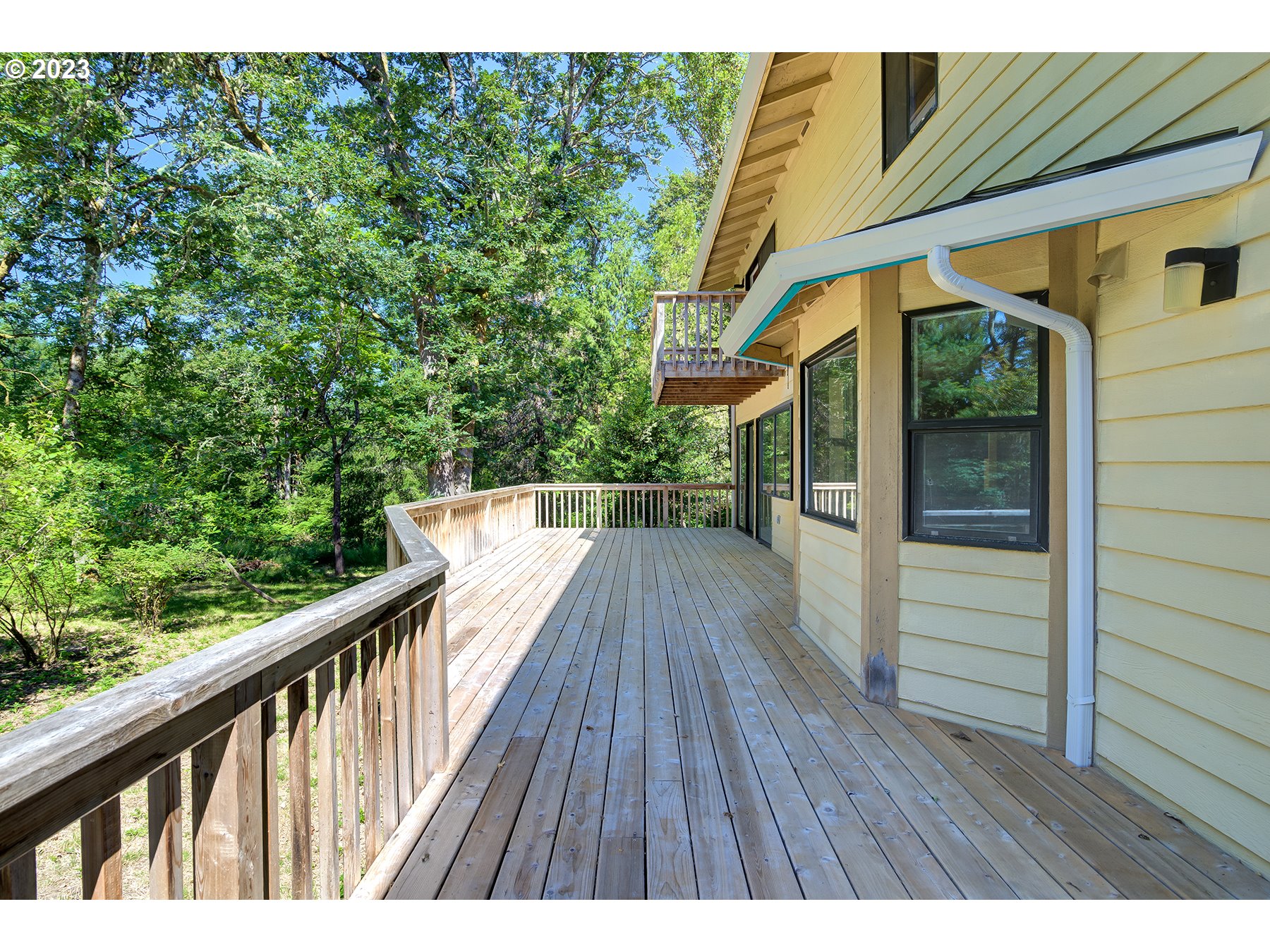 29510 Northwest 63rd Avenue Ridgefield, WA 98642 - Photo 35 of 38 a balcony with wooden floor
