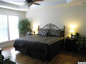 226 State Rd S-29-804 Fort Mill, SC 29707 - Photo 6 of 16 a bedroom with a bed and a potted plant