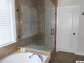 226 State Rd S-29-804 Fort Mill, SC 29707 - Photo 7 of 16 a bathroom with a bathtub and a shower