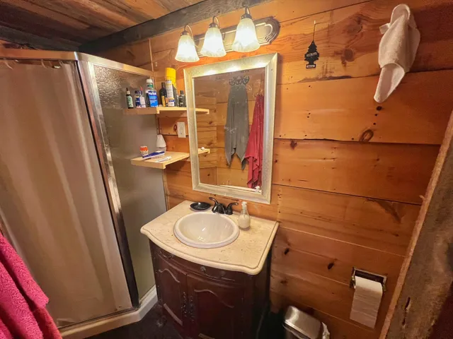 a bathroom with a sink and mirror