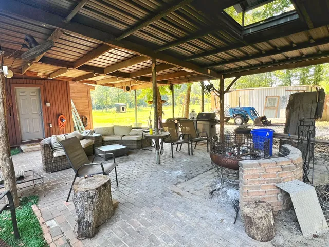 a view of a tables and chairs in the patio