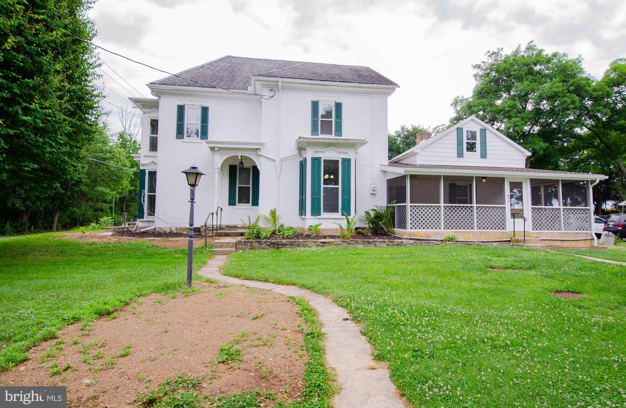 2615 Walnut Bottom Road Carlisle, PA 17015 - Photo 4 of 38 Charming two-story home with lush greenery.