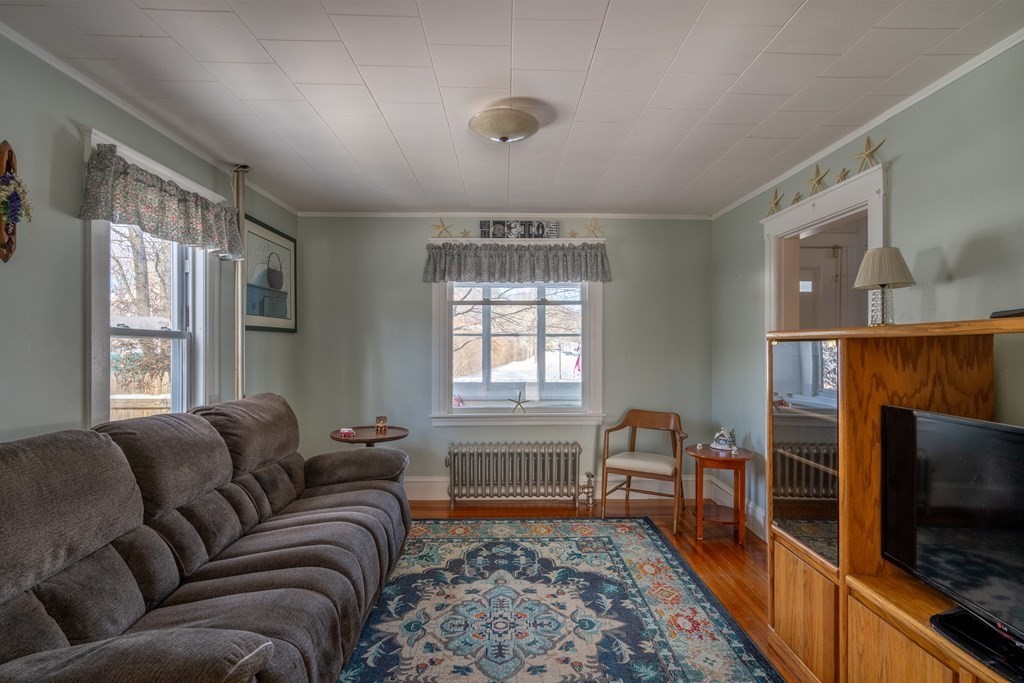 61 Bridge Road Northampton, MA 01062 - Photo 15 of 34 a living room with furniture and a flat screen tv