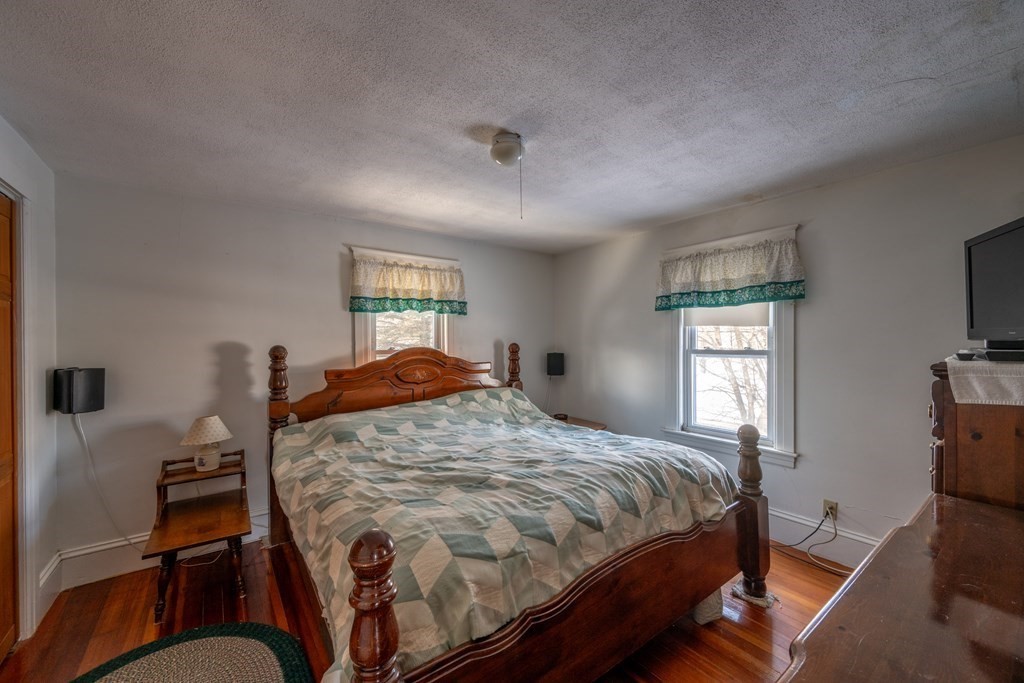 61 Bridge Road Northampton, MA 01062 - Photo 18 of 34 a bed sitting in a bedroom next to a window