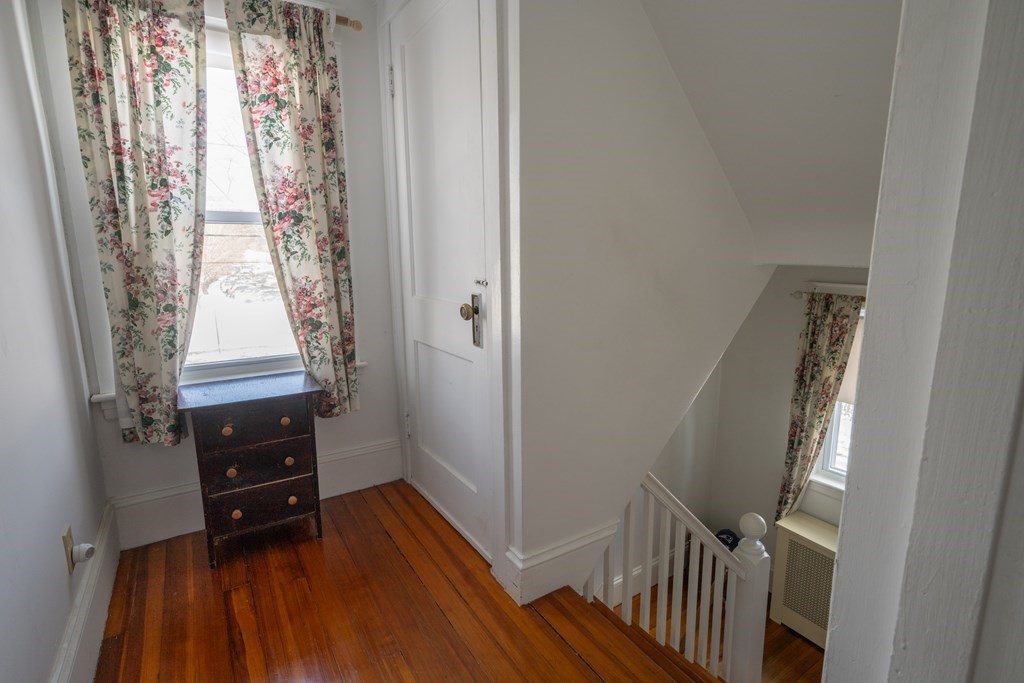 61 Bridge Road Northampton, MA 01062 - Photo 22 of 34 a view of a hallway with wooden floor and stairs