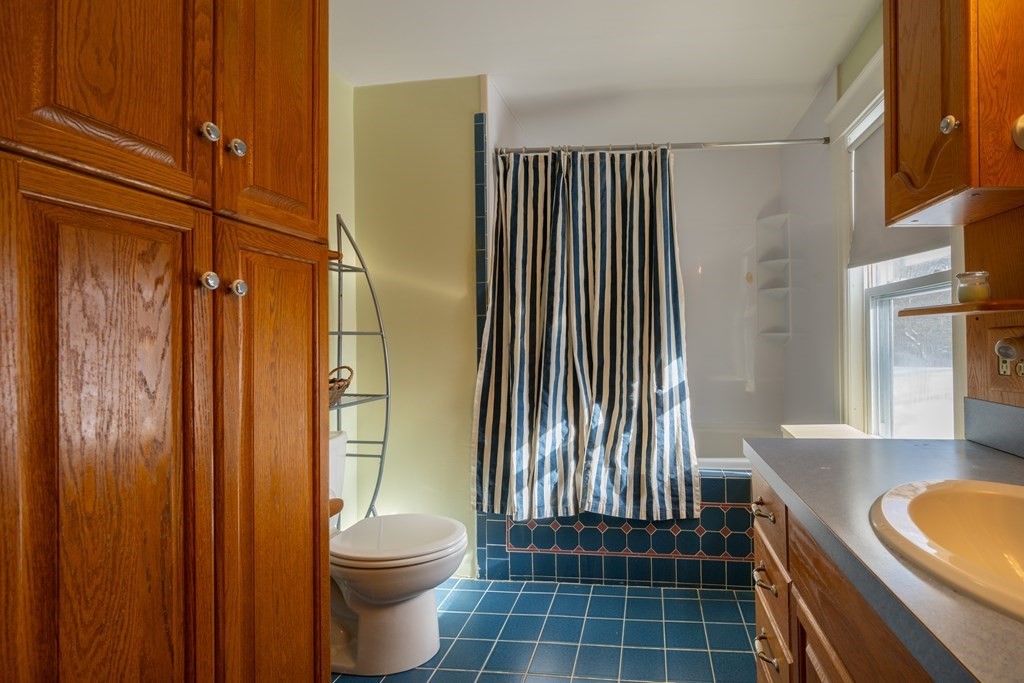 61 Bridge Road Northampton, MA 01062 - Photo 23 of 34 a bathroom with a granite countertop sink toilet and shower