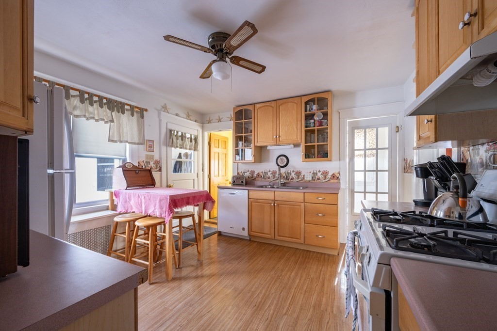 61 Bridge Road Northampton, MA 01062 - Photo 6 of 34 a dining room with wooden floor and stainless steel appliances