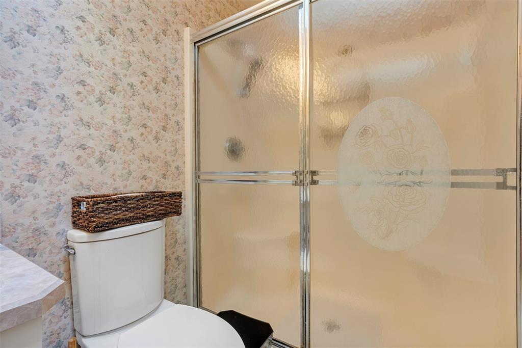 11447 Southwest 69th Circle Ocala, FL 34476 - Photo 17 of 32 a bathroom with a toilet and a shower