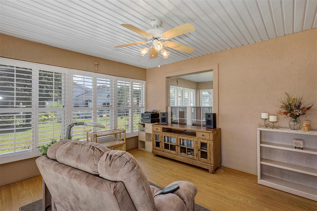 11447 Southwest 69th Circle Ocala, FL 34476 - Photo 25 of 32 a living room with furniture and a large window