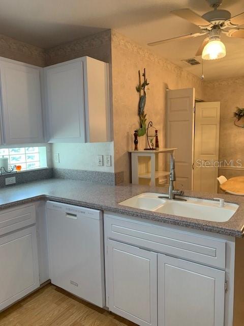 11447 Southwest 69th Circle Ocala, FL 34476 - Photo 7 of 32 a bathroom with a sink and a mirror