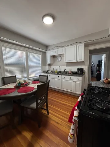 a kitchen with a stove and a refrigerator